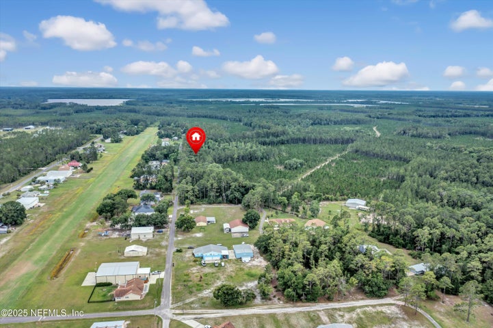 Aerial view across the wooded Air Park Loop parcel